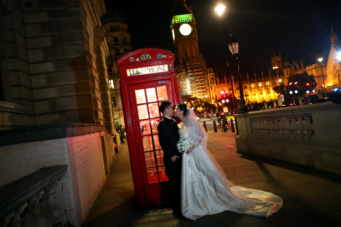 A couple poses for a wedding photo in central London, Britain.